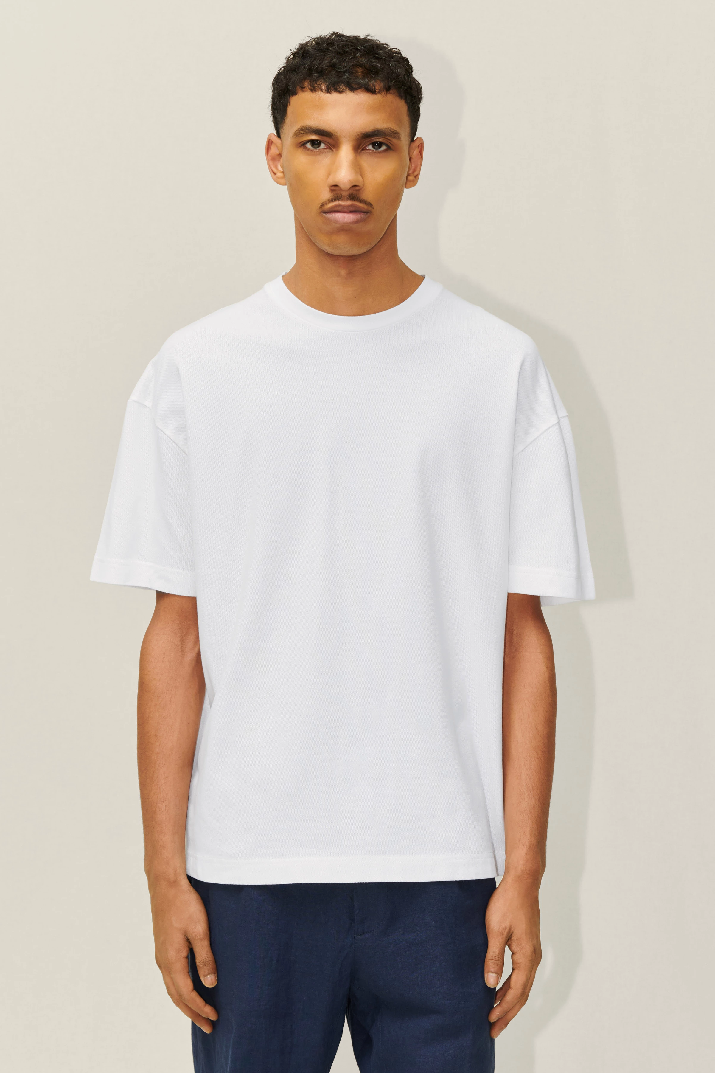 TOMMY - T-Shirt aus Baumwoll-Piqué - Herren - weiß - Frontansicht