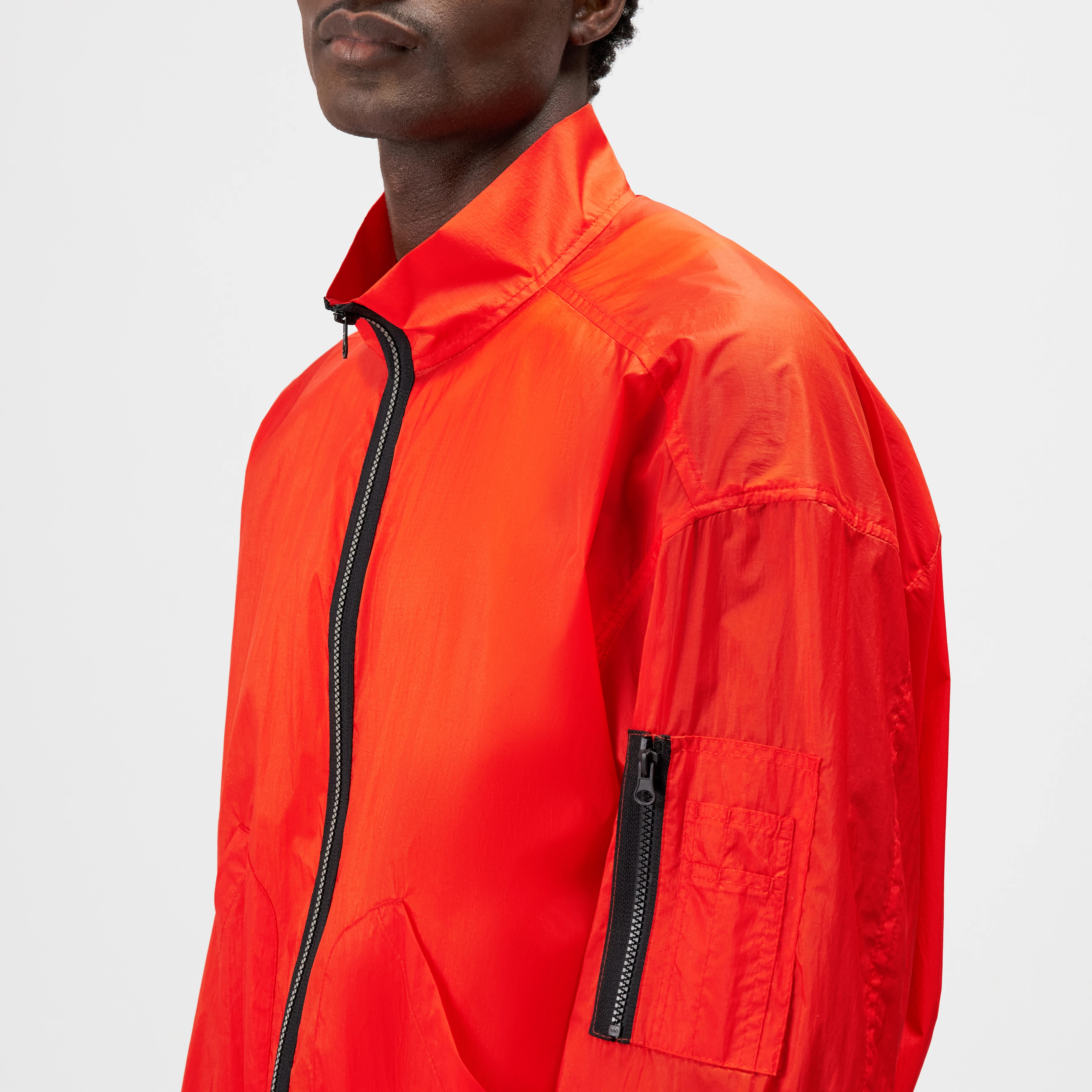 NILIZIO - Ripstop blouson with a technical finish - men - orange - Detailansicht am Model