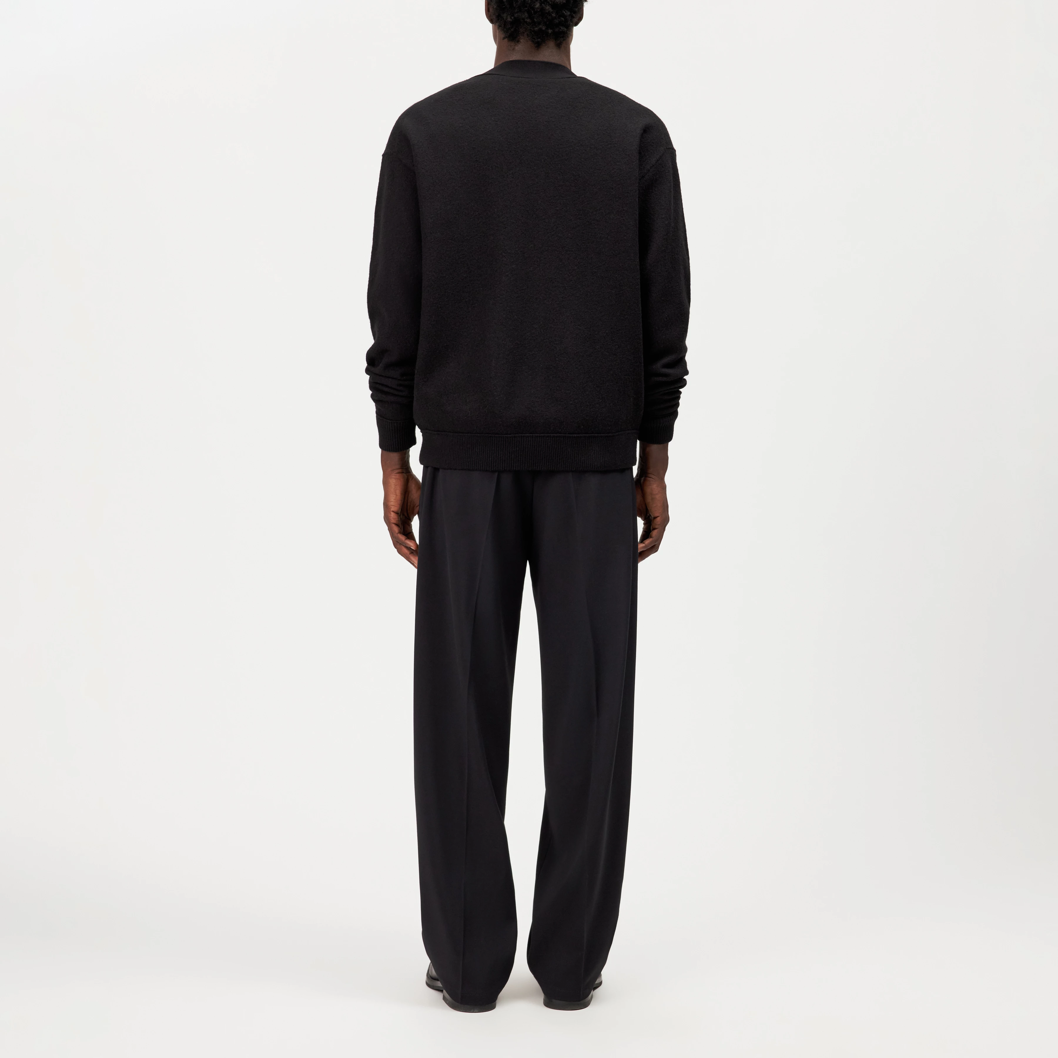 THEELO - Pure wool V-neck cardigan - men - black - Rückansicht