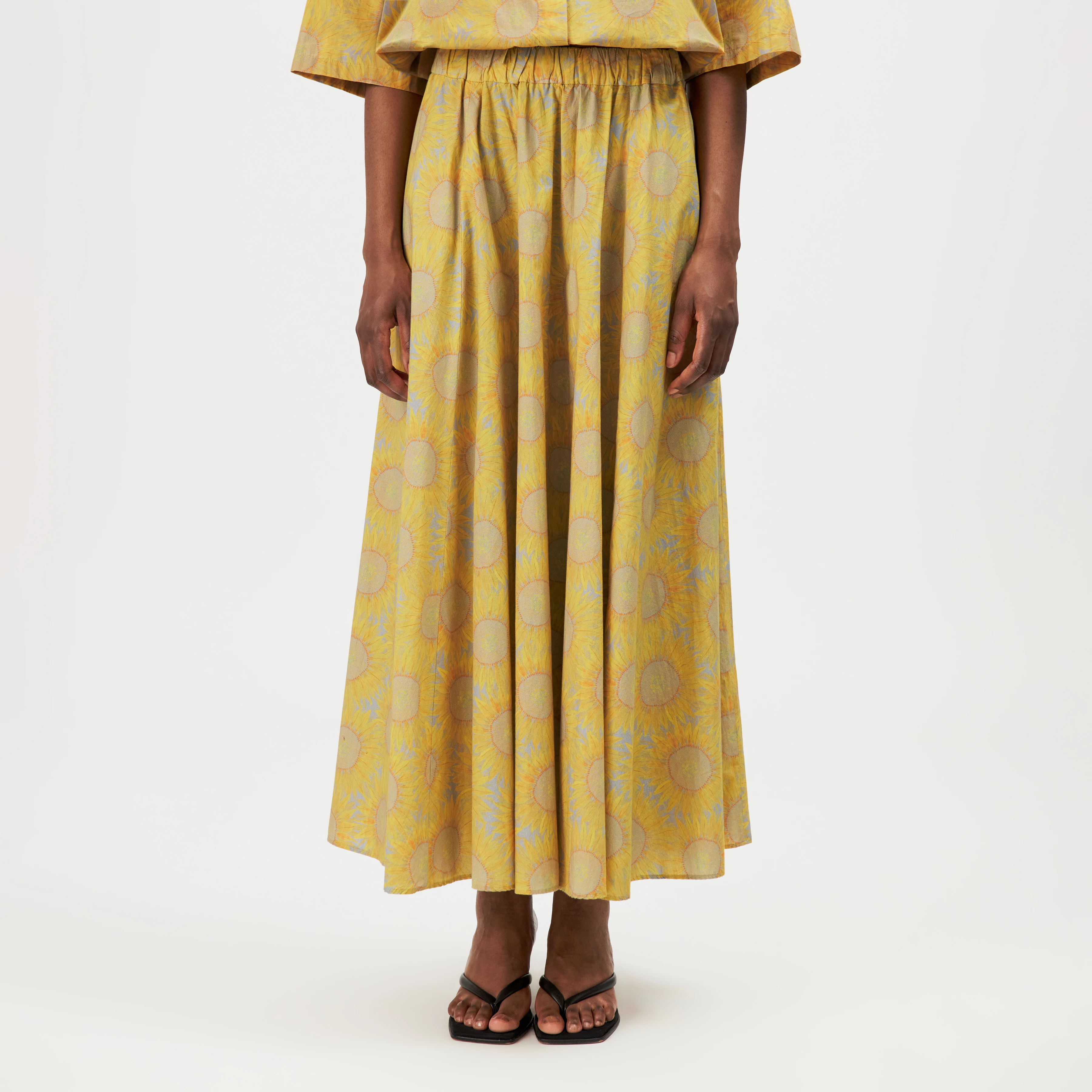 QERIME - Pleated cotton skirt with sunflower print - women - yellow - Frontansicht