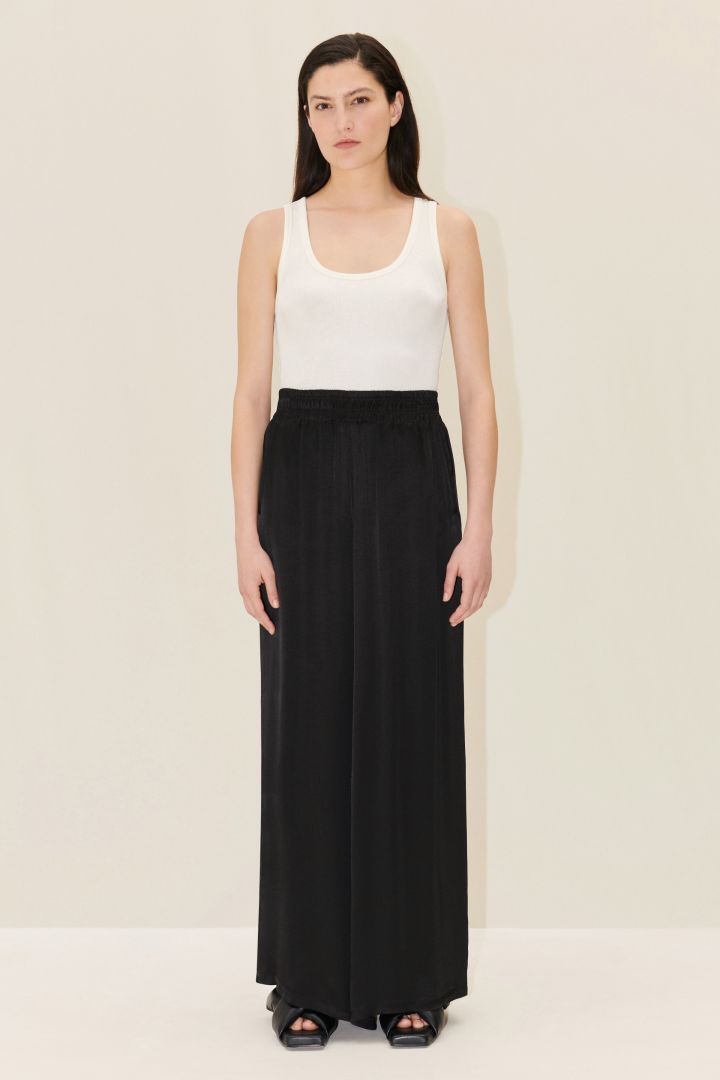 Palazzo pants with elasticated waistband in flowing viscose satin